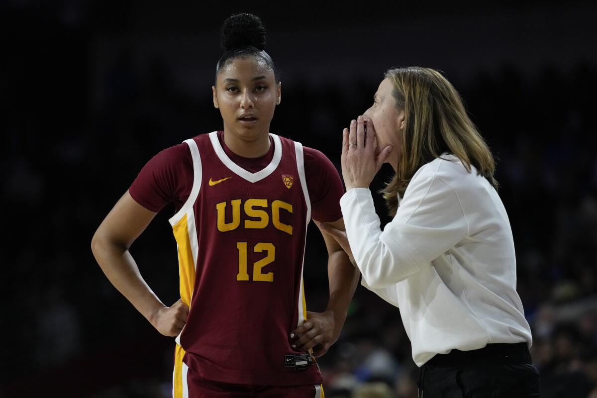 USC coach Lindsay Gottlieb talks with star guard JuJu Watkins during a game against UCLA this season.