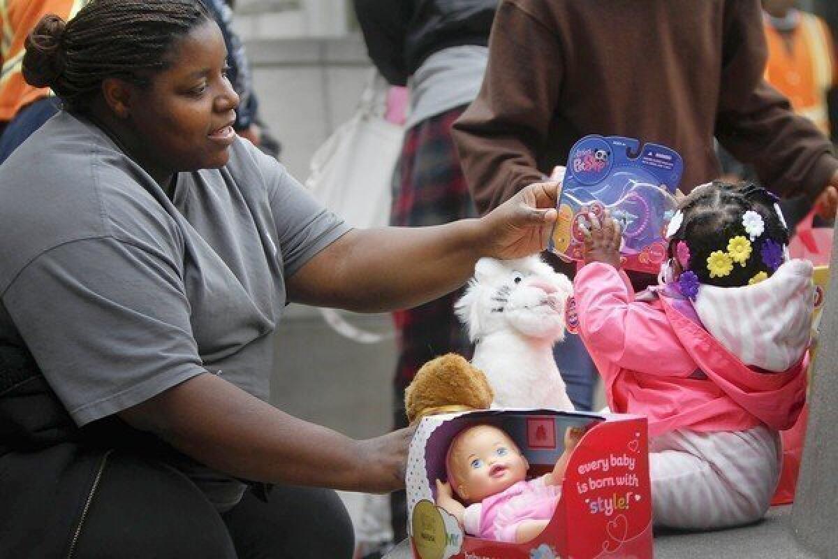 Latoya Williams brought daughter Madison to the Midnight Mission for her first Christmas.