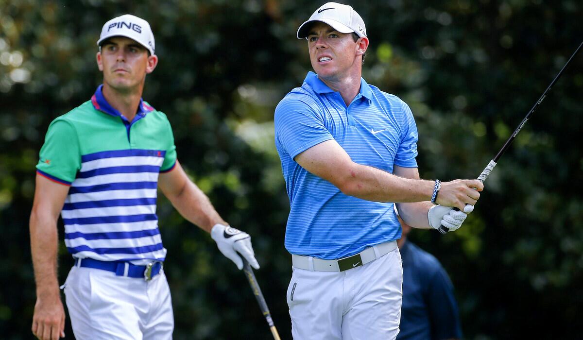 Rory McIlroy watches his tee shot at No. 8 along with Billy Horschel during the third round of the Tour Championship on Saturday.