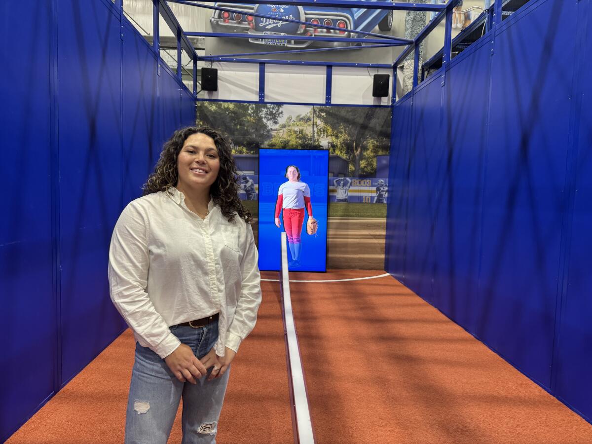 Former UCLA softball pitcher Rachel Garcia stands in the batting cage.