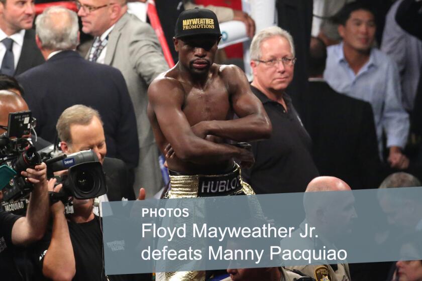 Floyd Mayweather Jr. celebrates after defeating Manny Pacquiao for the WBC welterweight championship at the MGM Grand Garden Arena on May 2, 2015.