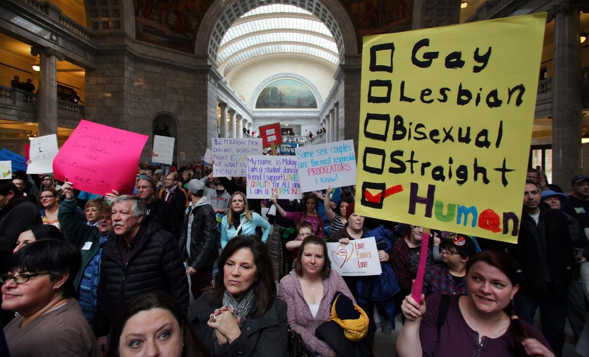 Supporters of gay marriage fill the rotunda during a rally at the Utah State Capitol.