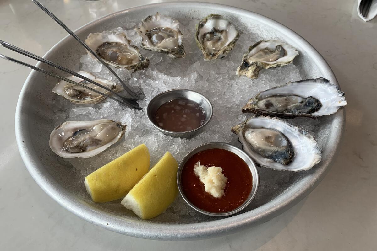 Shop for seafood to take home or sit down at the oyster bar and eat them fresh at Santa Monica Seafood Market & Cafe