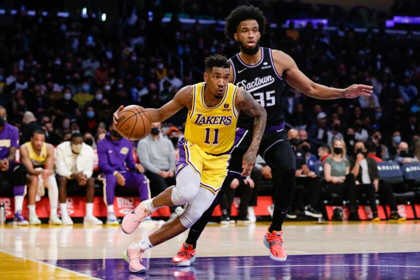 LOS ANGELES, CA - JANUARY 04: Los Angeles Lakers guard Malik Monk (11) drives against the Sacramento Kings on Tuesday, Jan. 4, 2022 in Los Angeles, CA. (Jason Armond / Los Angeles Times)