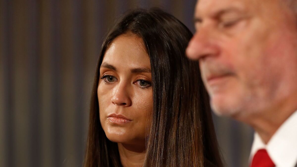 Actress Dominique Huett stands next to her attorney Jeff Herman during a news conference at the Palomar Hotel in Westwood. Huett alleges she was sexually harassed by Harvey Weinstein.