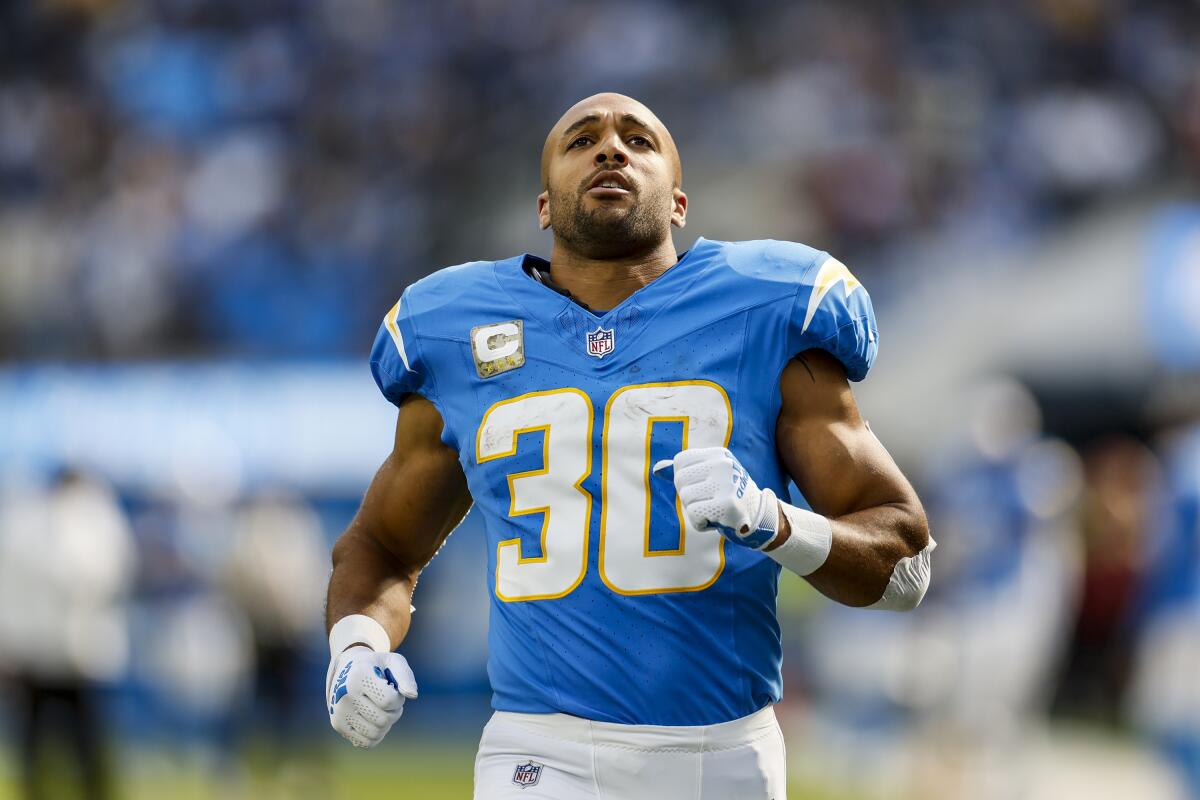 Chargers running back Austin Ekeler warms up before a game.