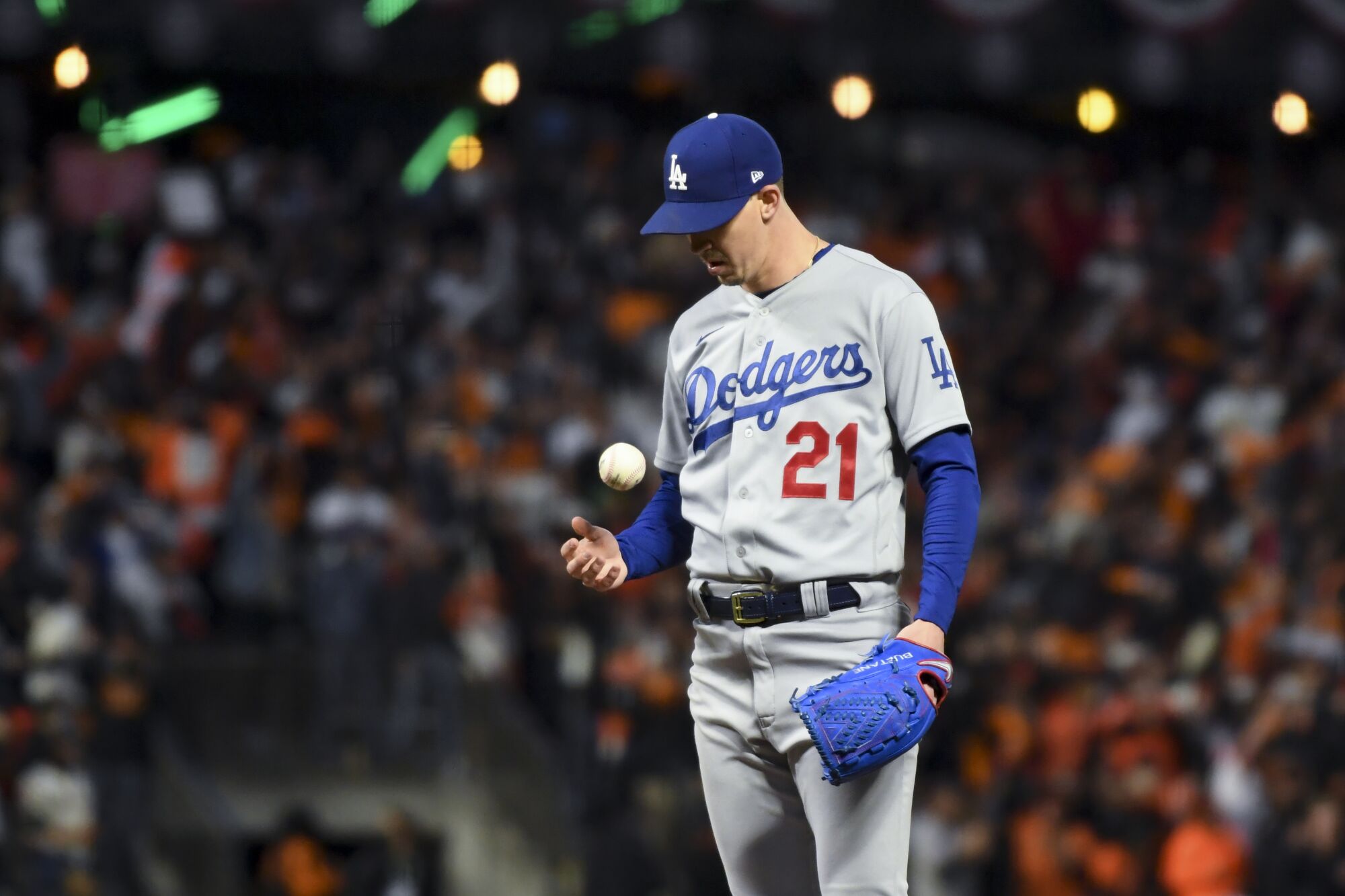  Dodgers starting pitcher Walker Buehler tosses the ball after giving up a two-run home run.
