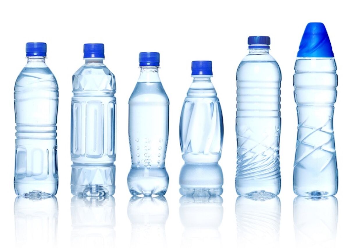 A lineup of plastic water bottles. 