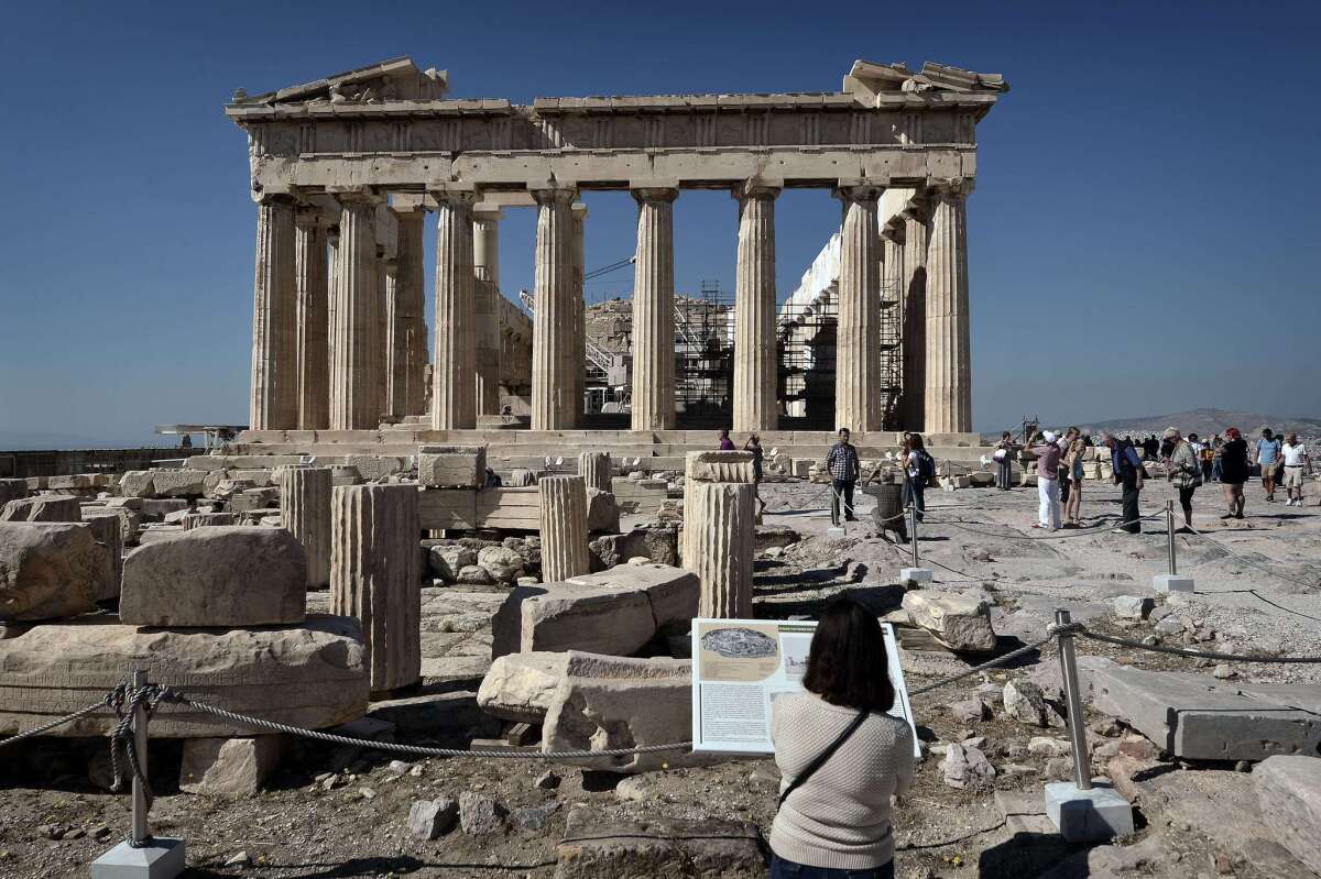 Human rights lawyer Amal Alamuddin Clooney visited Athens to advise the Greek government on its battle to repatriate the ancient Parthenon sculptures that are presently on display at the British Museum. Seen here: tourists visiting the Parthenon over the weekend.