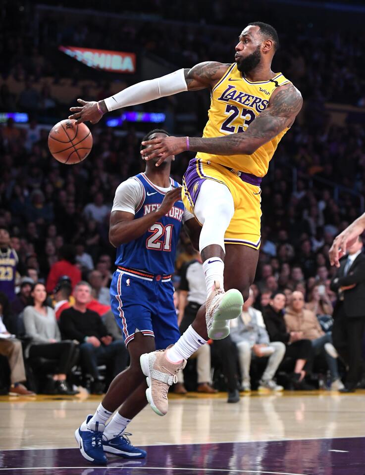 LeBron James throws a no-look pass during the second quarter of a game against the Knicks on Jan. 7 at Staples Center.