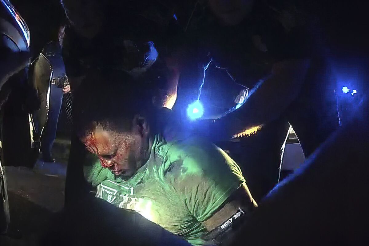 FILE - This image from video from Louisiana State Police Trooper Dakota DeMoss' body-worn camera shows troopers holding up Ronald Greene before paramedics arrived on May 10, 2019, outside of Monroe, La. No longer waiting for a federal investigation, state prosecutor Union Parish District Attorney John Belton says he intends to pursue his own case against the Louisiana troopers involved in the deadly 2019 arrest of Greene. (Louisiana State Police via AP, File)