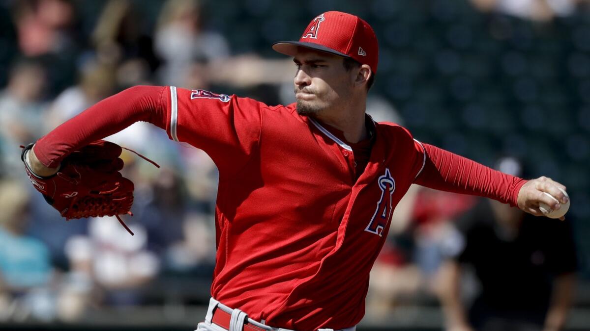 Angels starting pitcher Andrew Heaney throws against the Oakland Athletics during the first inning of a spring game in Mesa, Ariz. on Feb. 26.
