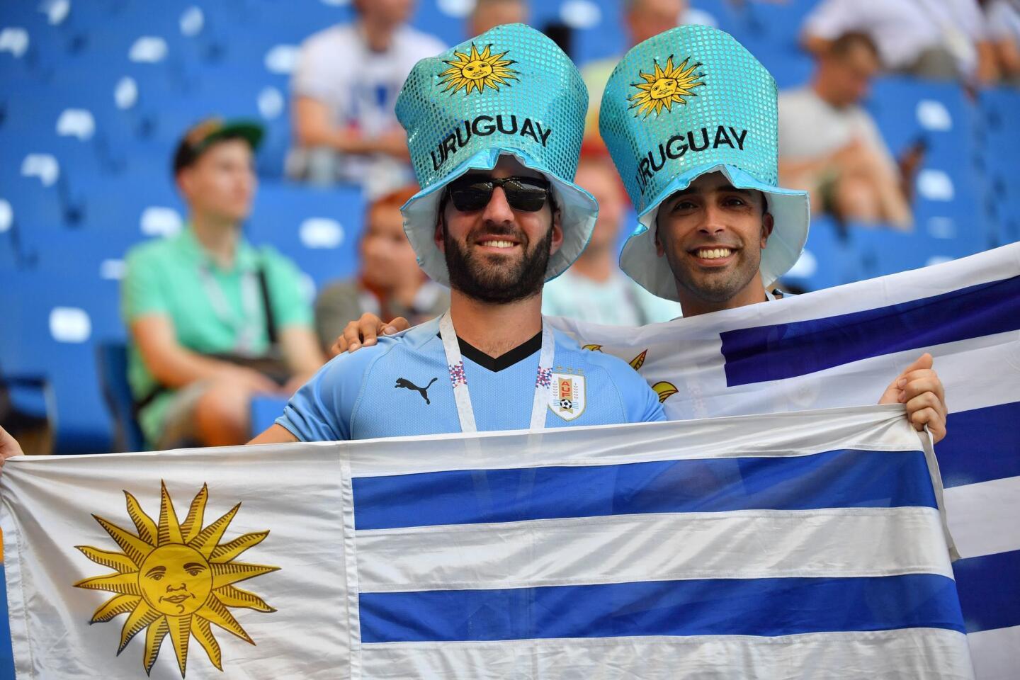 Uruguay fans pose with national flags ahead of kick off of the Russia 2018 World Cup Group A football match between Uruguay and Saudi Arabia at the Rostov Arena in Rostov-On-Don on June 20, 2018. (Photo by Pascal GUYOT / AFP) / RESTRICTED TO EDITORIAL USE - NO MOBILE PUSH ALERTS/DOWNLOADS (Photo credit should read PASCAL GUYOT/AFP/Getty Images)