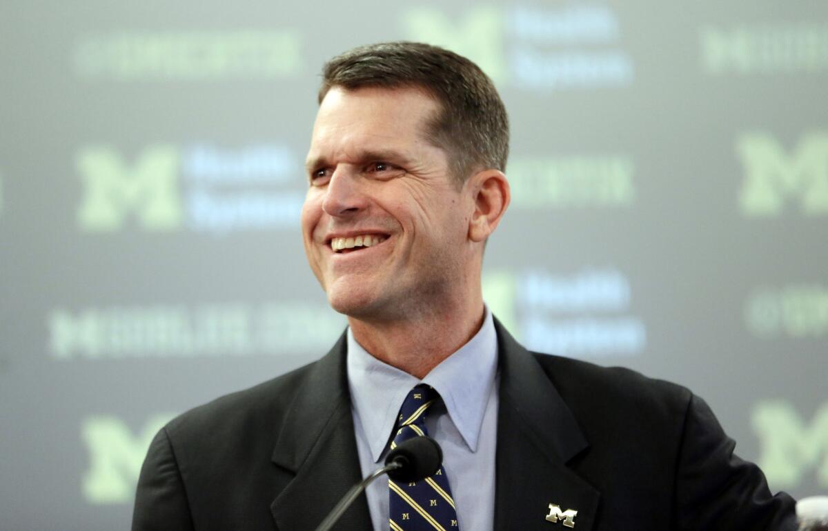 New Michigan Coach Jim Harbaugh after being introduced at a news conference Tuesday in Ann Arbor, Mich.