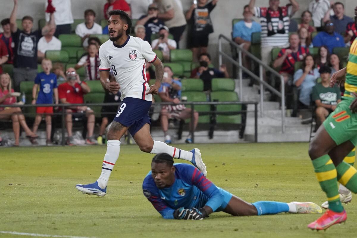 U.S. forward Jesus Ferreira (9) watches his goal past Grenada goalkeeper Jason Belfon, at bottom, on June 10, 2022.