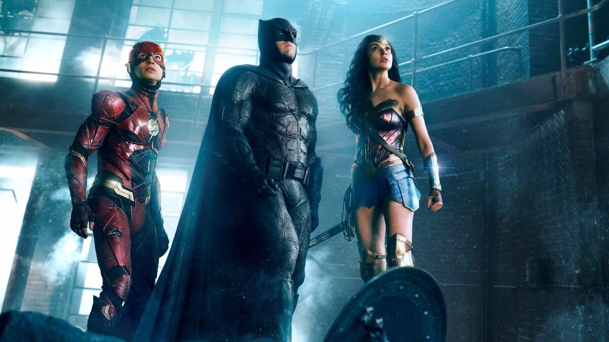 Ezra Miller, from left, Ben Affleck and Gal Gadot in "Justice League."