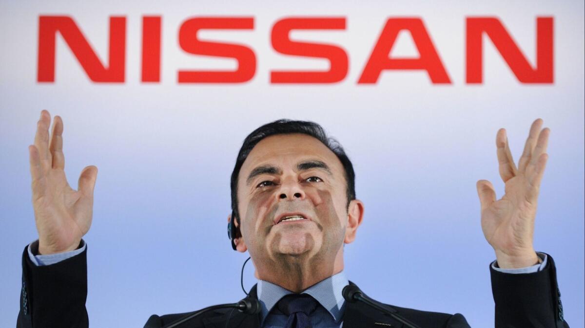 Carlos Ghosn, president and CEO of Japan auto giant Nissan, answers questions during a news conference at the company's headquarters in suburban Tokyo in 2012.
