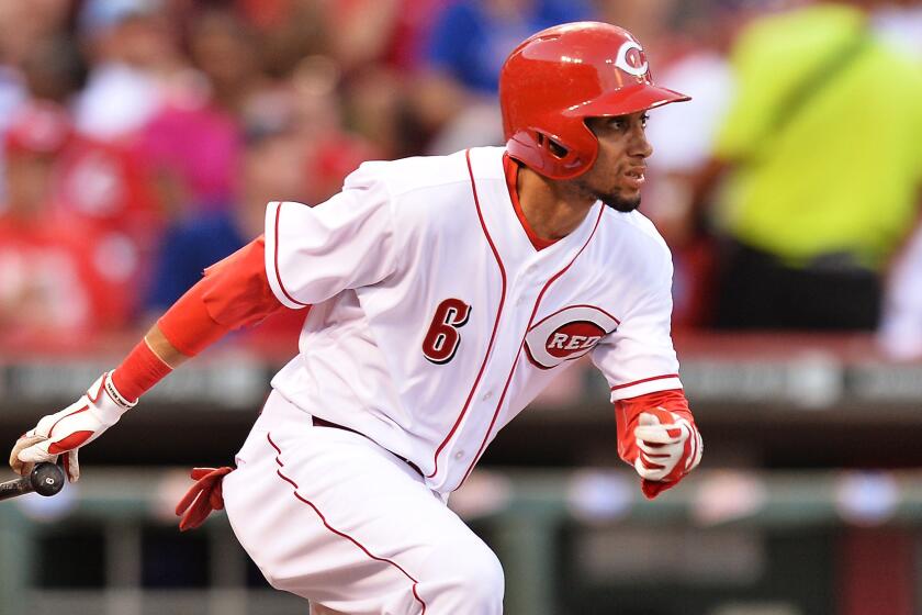 Cincinnati Reds rookie Billy Hamilton triples during a game against the Chicago Cubs on July 9.