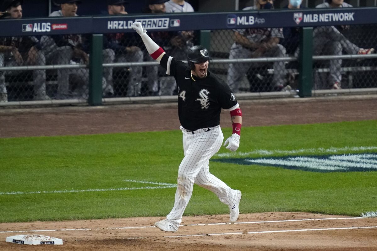 Yasmani Grandal celebrates after hitting a solo home run during the third inning of a 12-6 win.