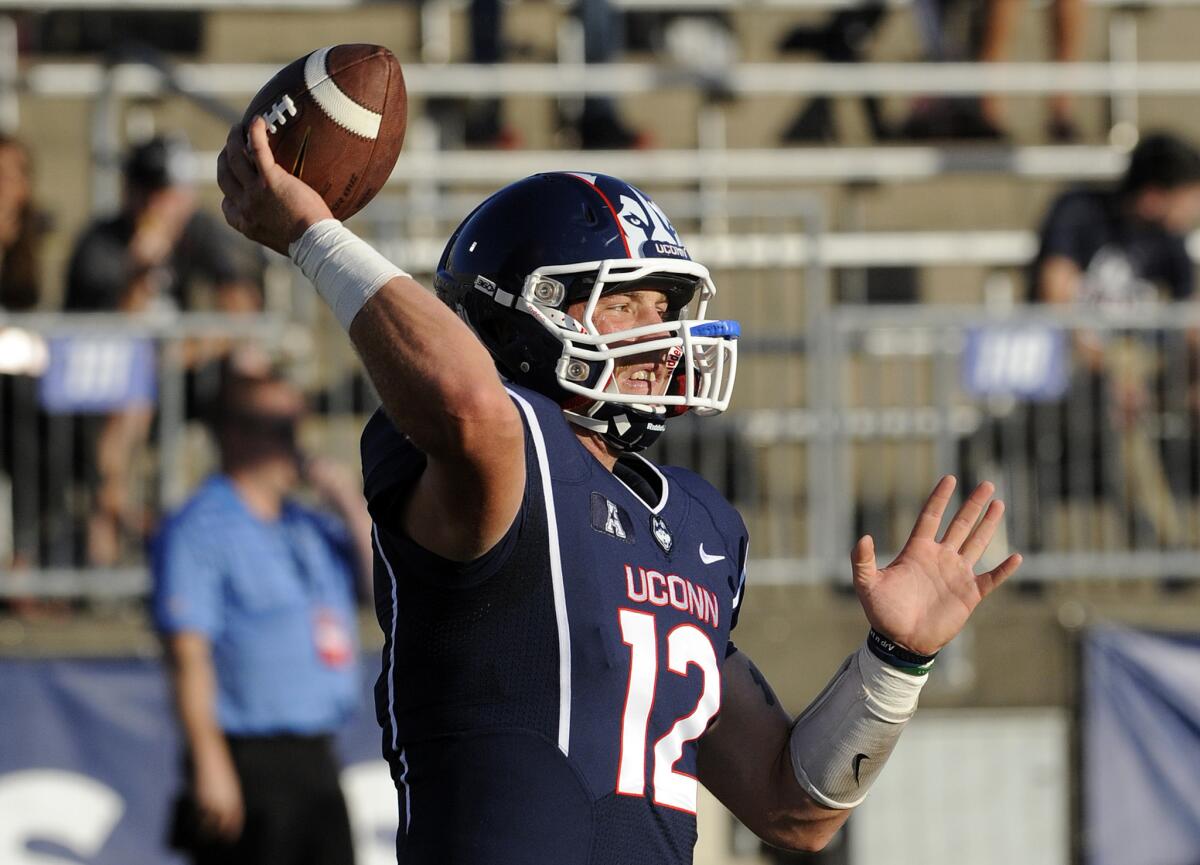 Connecticut quarterback Casey Cochran, who was injured in the first game of the season after winning the starting job, has decided to end his football career because of multiple concussions, school officials announced Sept. 8.