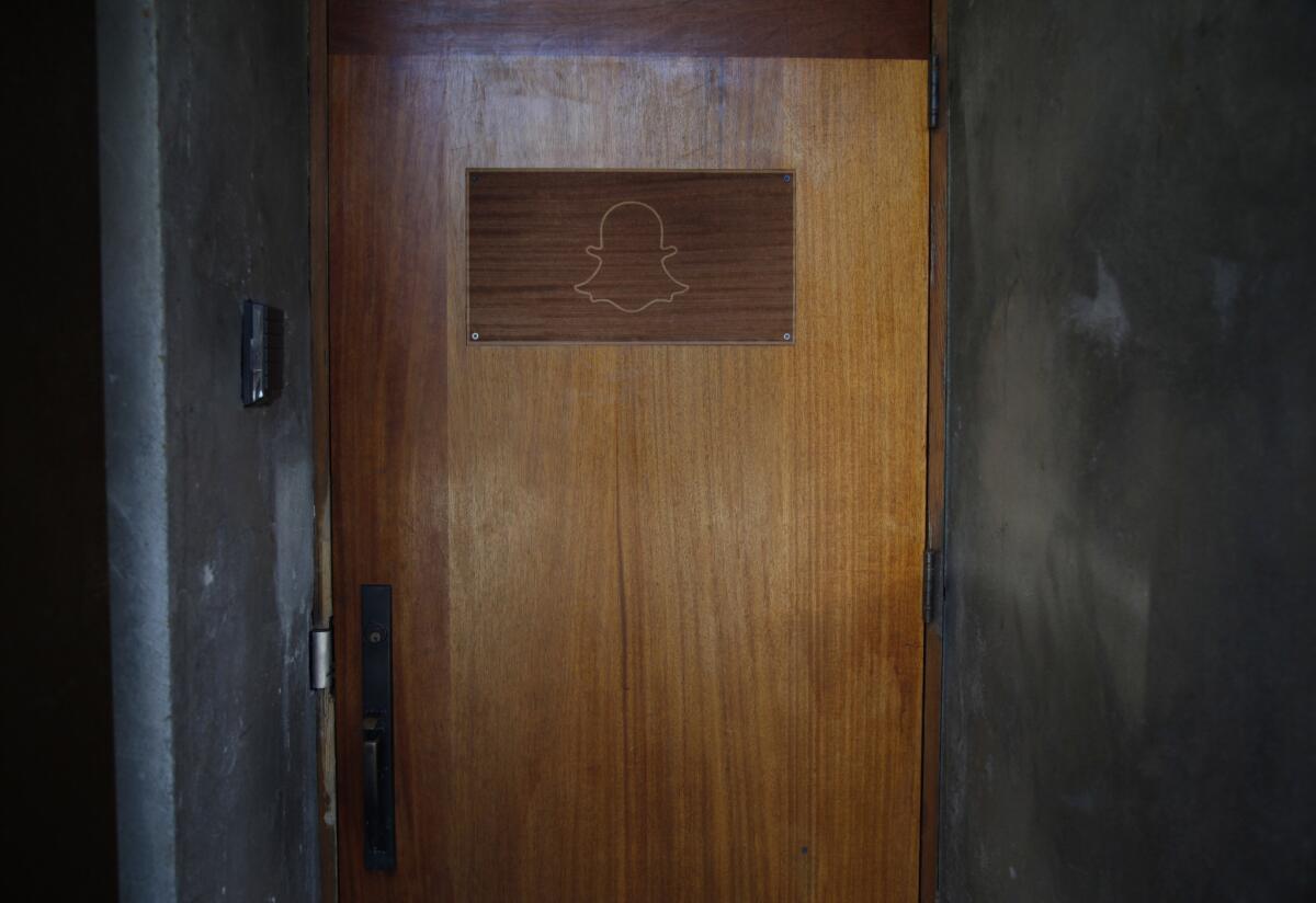 Snapchat's logo on the front door at its 64 Market St. headquarters in Venice, Calif.