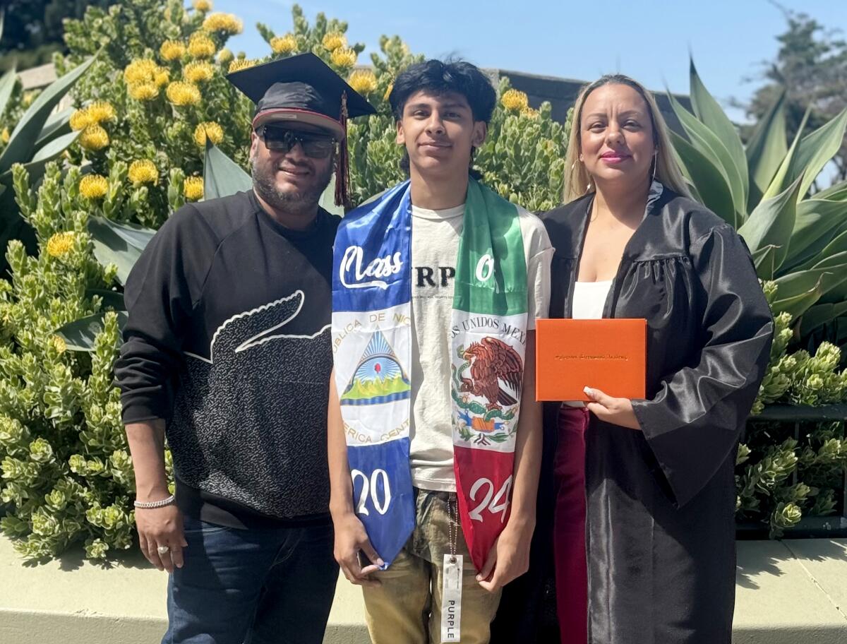 An undated handout photo shows Ricardo "Ricky" Ramirez Jr., center, flanked by his parents. 