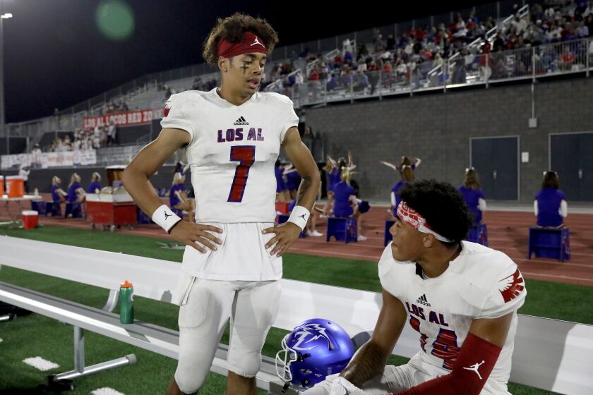 MISSION VIEJO, CA - SEPTEMBER 17: Quarterback Malachi Nelson (7), of Los Alamitos, with Makai Lemon,14, during a game against Santa Margarita in the first half at Saddleback College Stadium on Friday, Sept. 17, 2021 in Mission Viejo, CA. (Gary Coronado / Los Angeles Times)