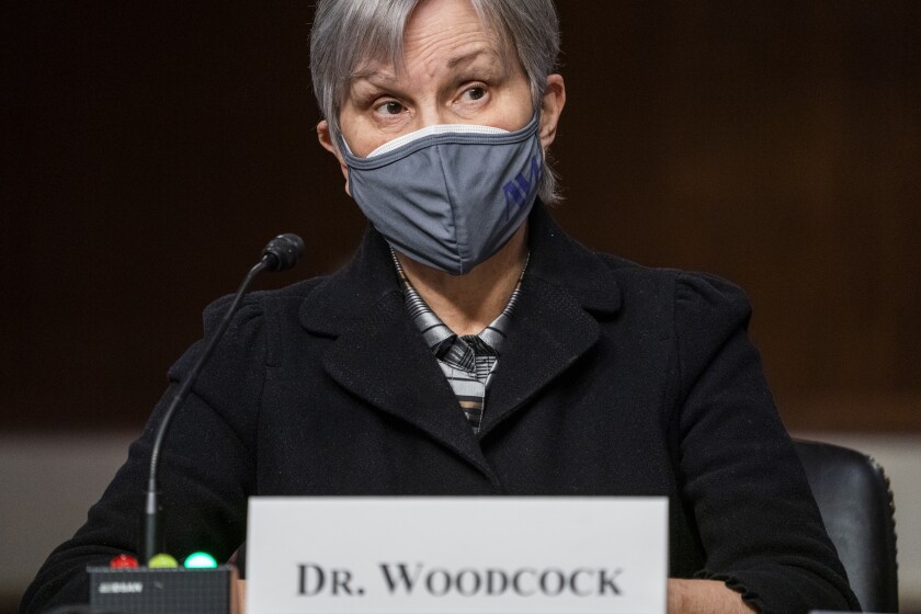 Dr Janet Woodcock memakai topeng saat dia bersaksi di Capitol Hill pada hari Selasa.