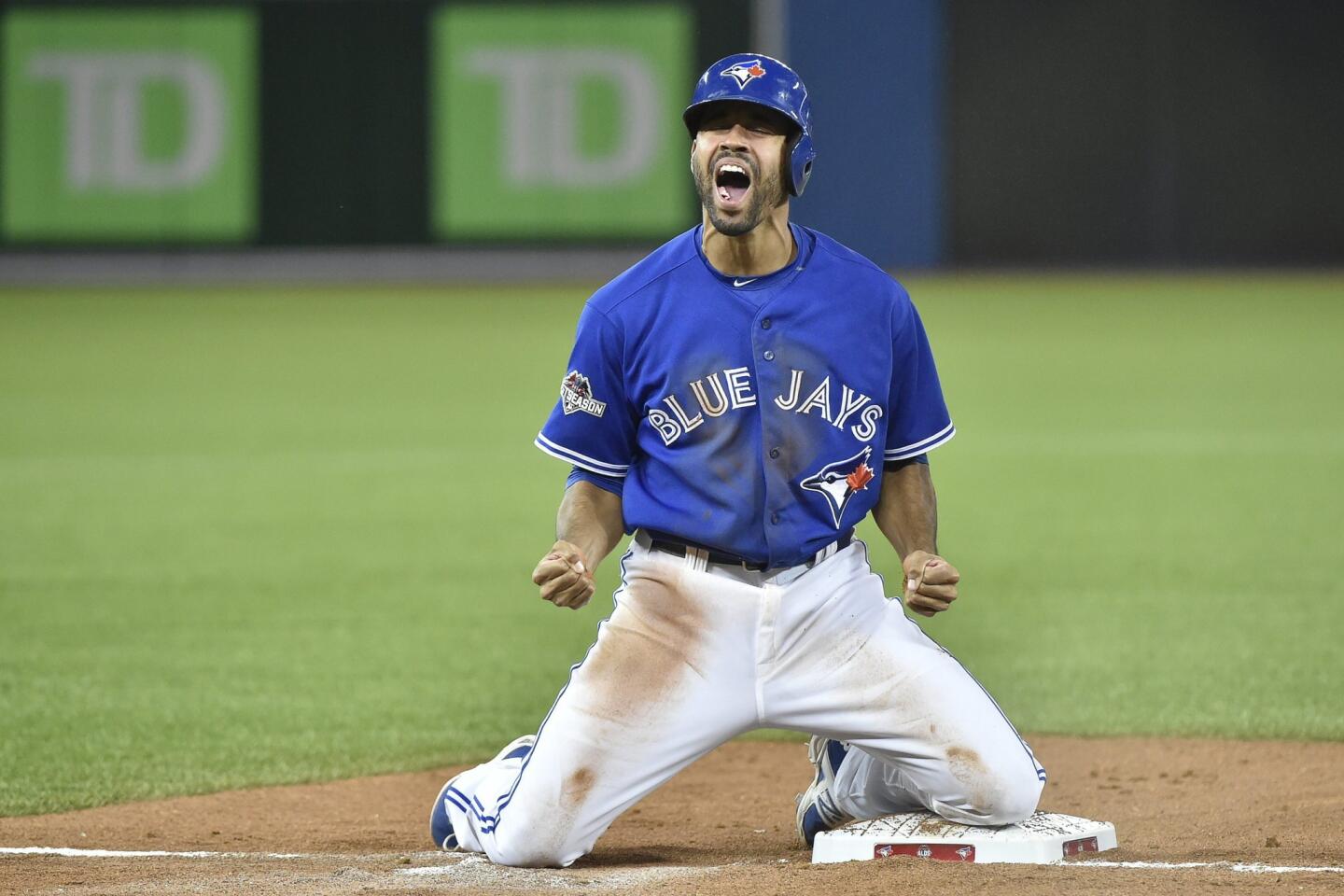 Toronto Blue Jays pinch-runner Dalton Pompey reacts as he is safe at third base during the seventh inning in Game 5 of baseball's American League Division Series against the Texas Rangers, Wednesday, Oct. 14, 2015, in Toronto. (Nathan Denette/The Canadian Press via AP) MANDATORY CREDIT