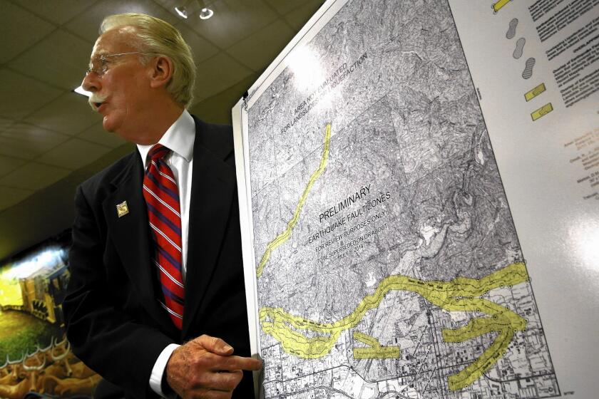 State geologist John Parrish presents a new map of the Sierra Madre fault in the foothill cities of eastern Los Angeles County during a news conference at which the Hollywood fault was also discussed.