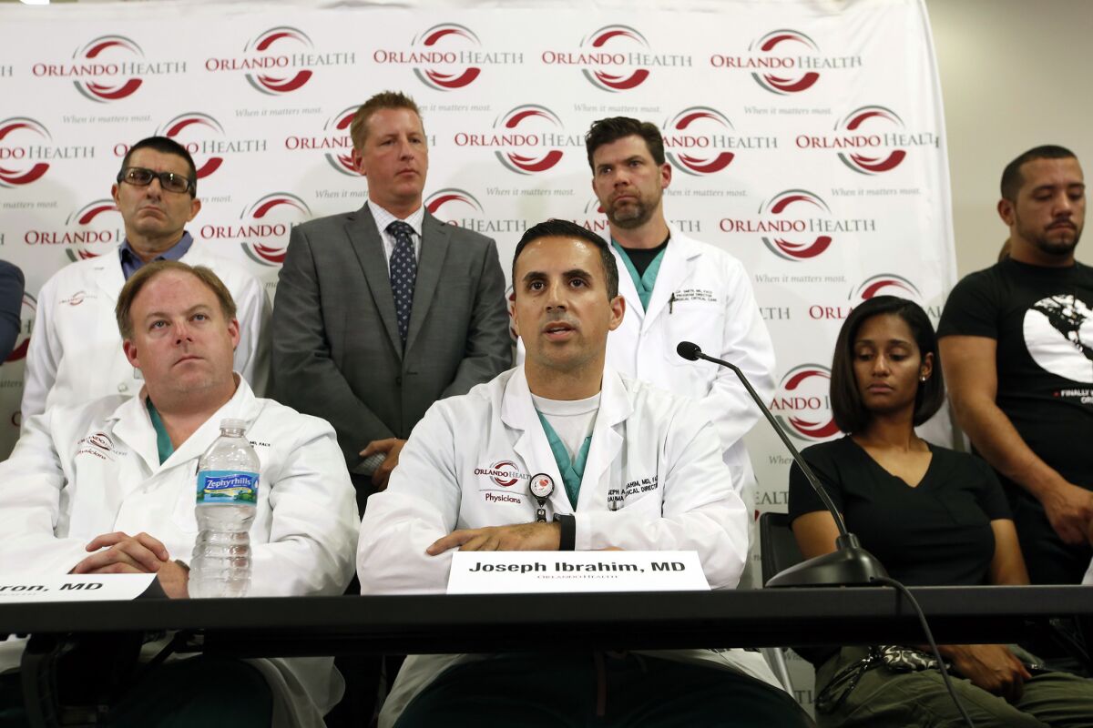 Dr. Joseph Ibrahim, center, answers questions about the attack on Pulse nightclub at a news conference in Orlando, Fla.