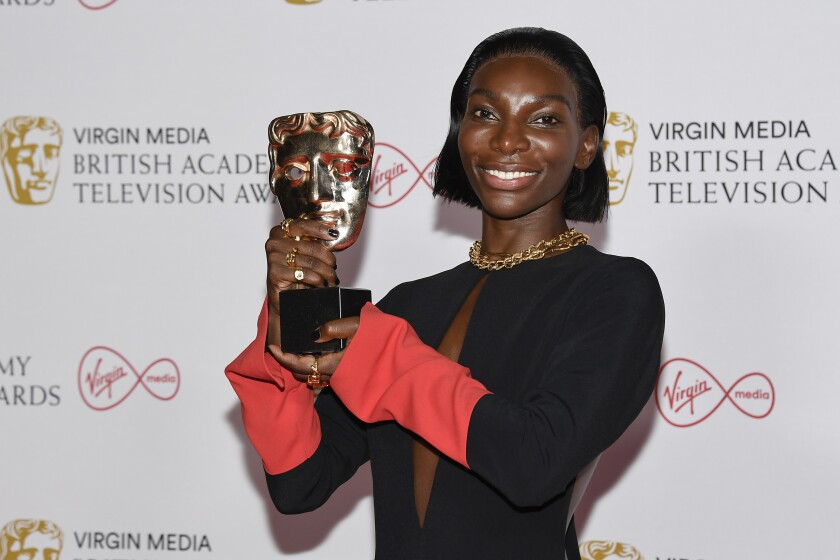 Michaela Coel poses for photographers with his Leading Actress award for her role in 'I May Destroy You' backstage at the British Academy Television Awards in London, Sunday, June 6, 2021. (AP Photo/Alberto Pezzali)