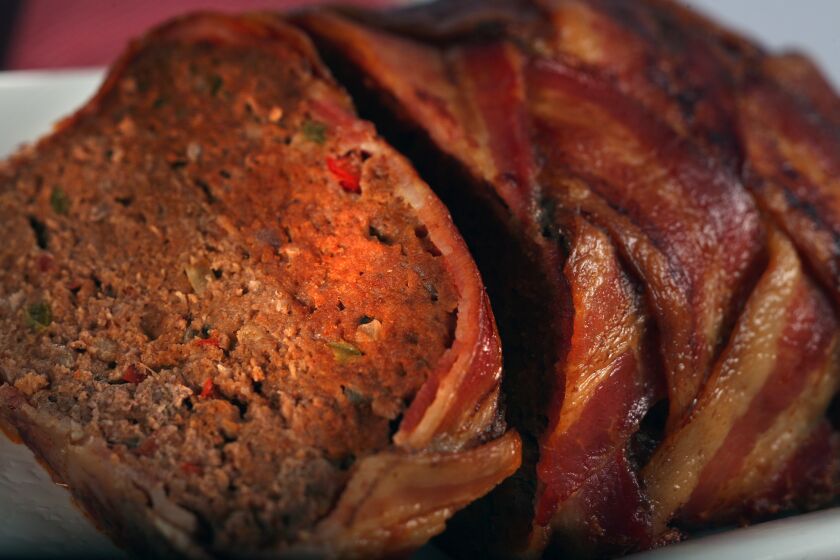 The meatloaf at Wildcat Willies includes venison and bison and is enveloped in bacon. Recipe