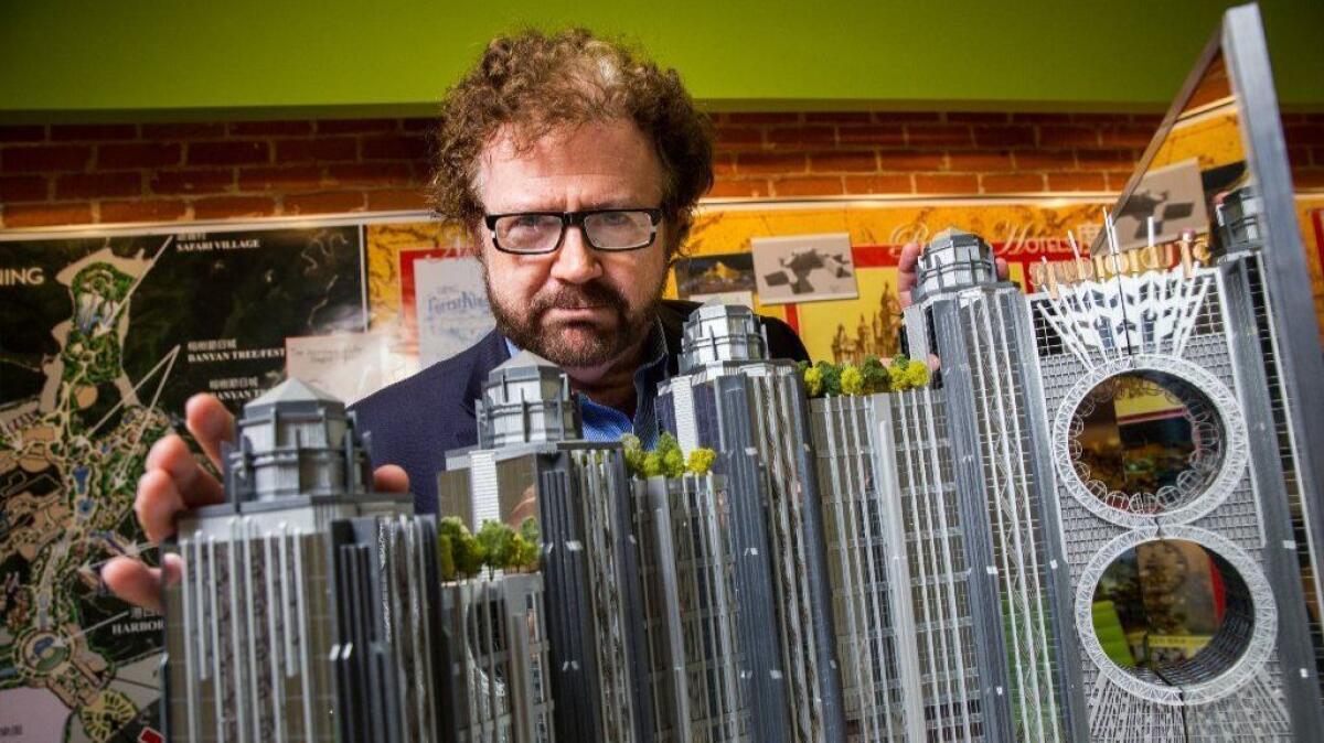 In an Oct. 2015 photo, Gary Goddard is pictured with a model of a Macau casino his firm designed.