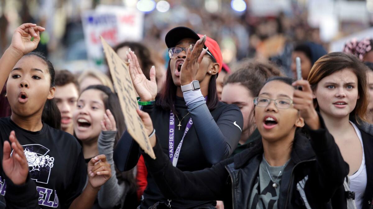 Students from Garfield High School march on Monday in Seattle with other young people who walked out of class to protest the election of Donald Trump.