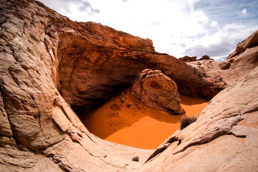 A bowl-like formation in reddish sandstone