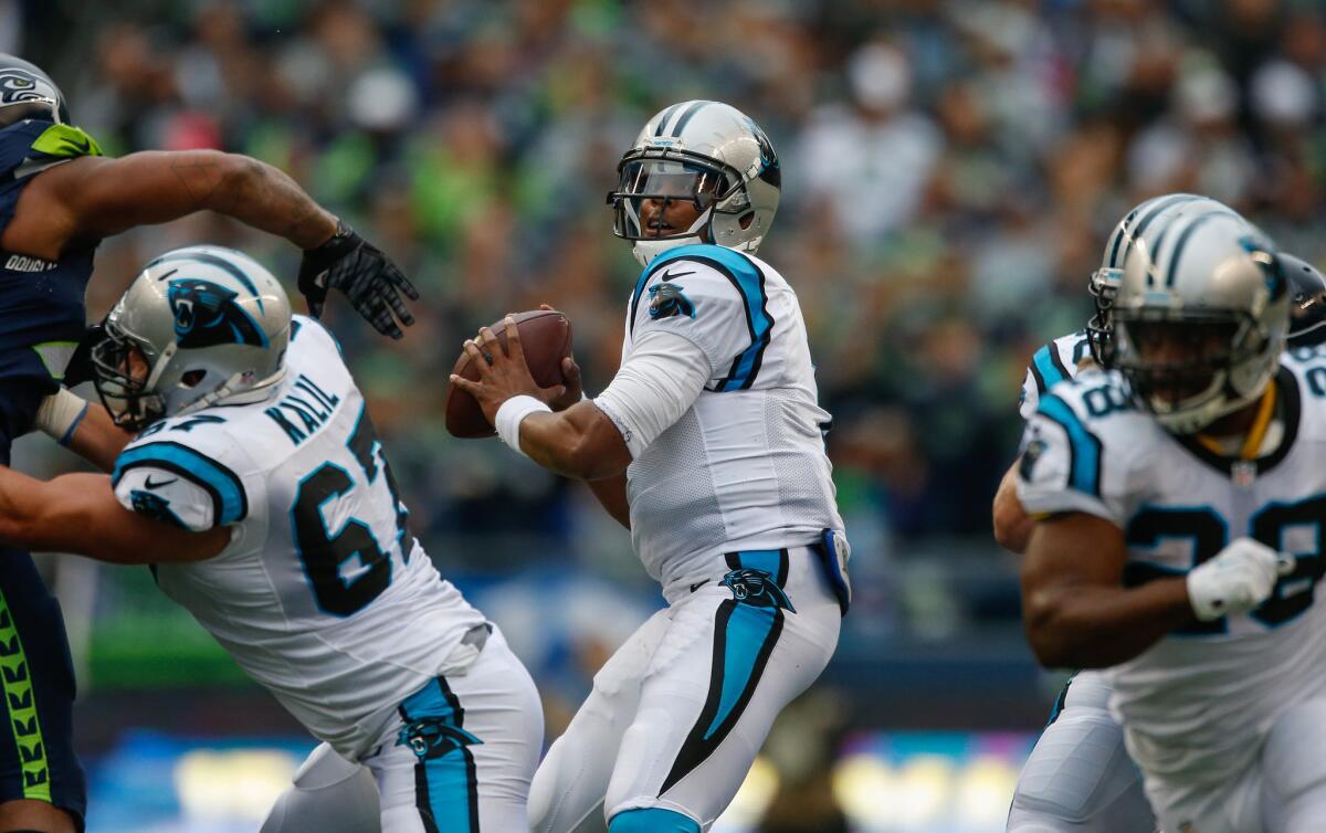 Former Panthers center Ryan Kalil (67) protects for quarterback Cam Newton, now reportedly a member of the Patriots.  