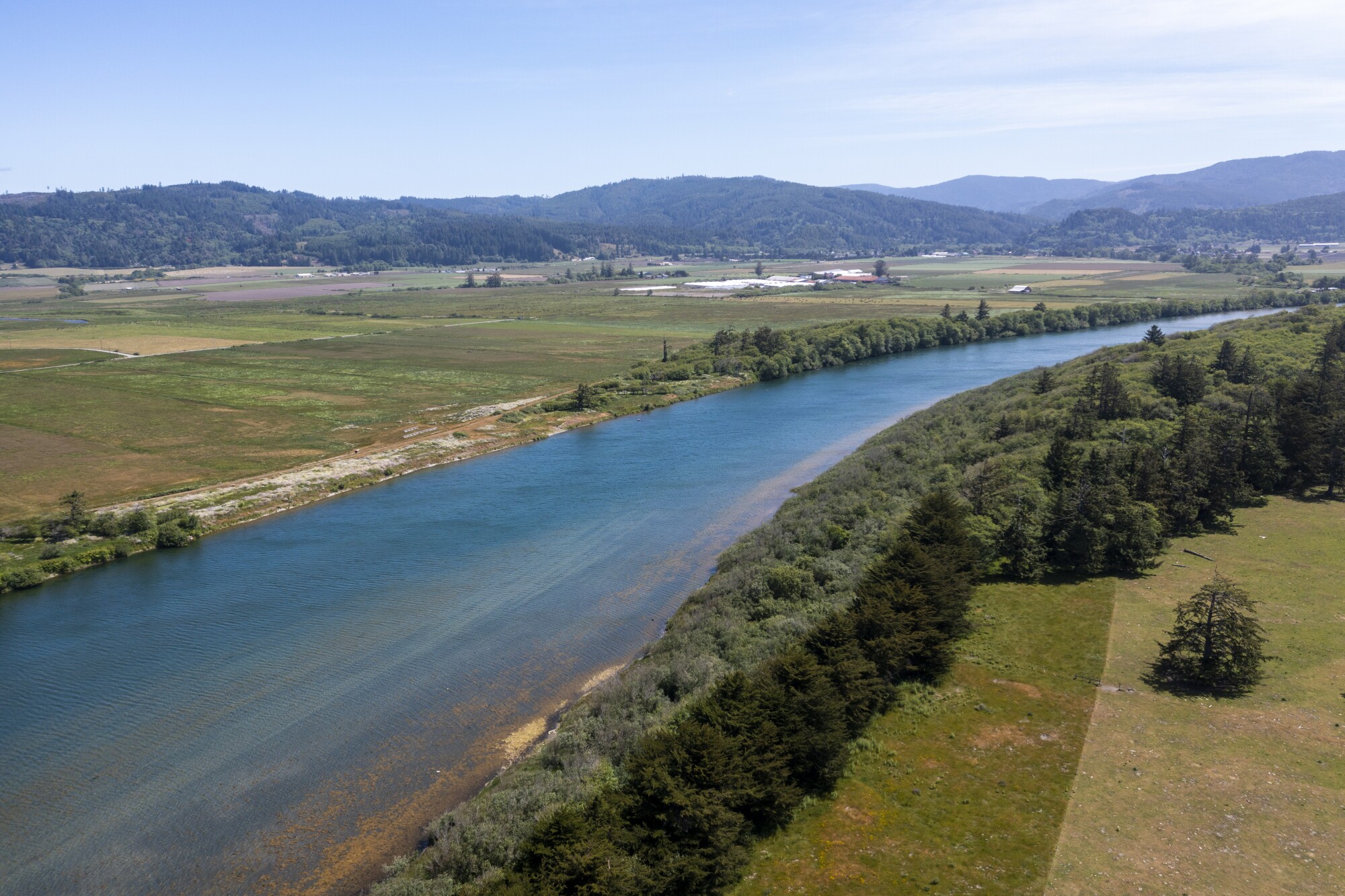 An aerial view of Reservation Ranch and agricultural operations, left, along the Smith River.
