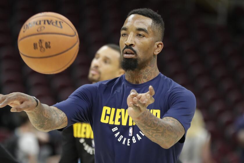 Cleveland Cavaliers guard JR Smith (5) makes a pass as the team practiced.