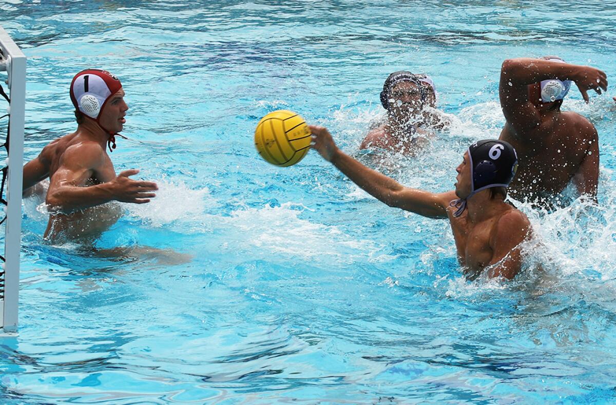 Newport Harbor's Jack Wright (6) sneaks it past Harvard-Westlake goalkeeper Baxter Chelsom (1) during Saturday's match.