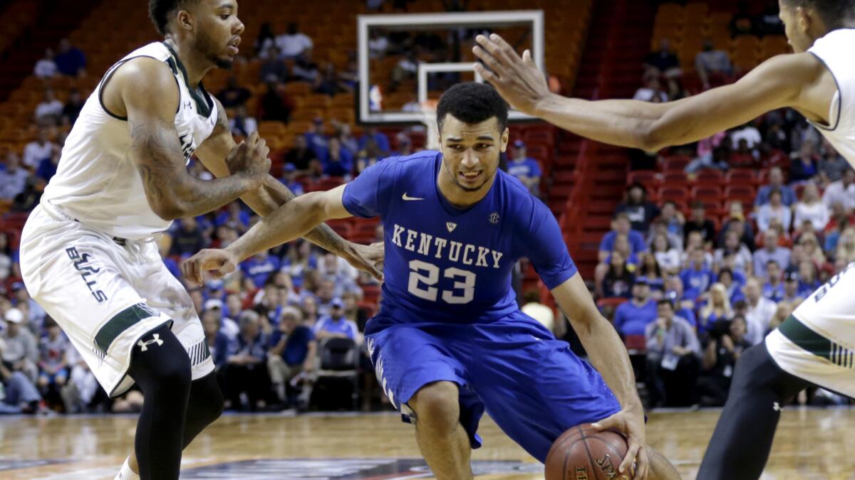 Kentucky guard Jamal Murray drives to the basket against South Florida guard Roddy Peters, left, and forward Angel Nunez in the second half Friday.