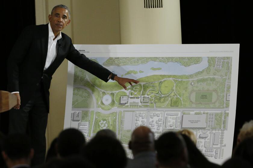FILE - In this May 3, 2017, file photo, former President Barack Obama points to a rendering for the former president's lakefront presidential center at a community event at the South Shore Cultural Center in Chicago. Obama's presidential center will move another step closer to its brick-and-mortar future Tuesday, Sept. 28, 2021 when ground is broken. (AP Photo/Nam Y. Huh, File)