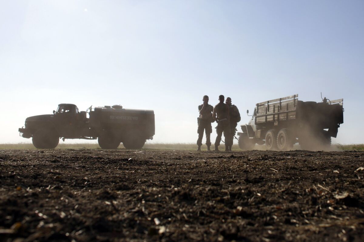 Ukrainian government forces take up positions near Luhansk on Aug. 20.
