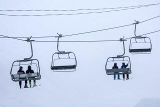 Mammoth Lakes, CA - March 14: Skiers ride chair 6 on a blustery day at Mammoth Mountain on Thursday, March 14, 2024 in Mammoth Lakes, CA. (Brian van der Brug / Los Angeles Times)