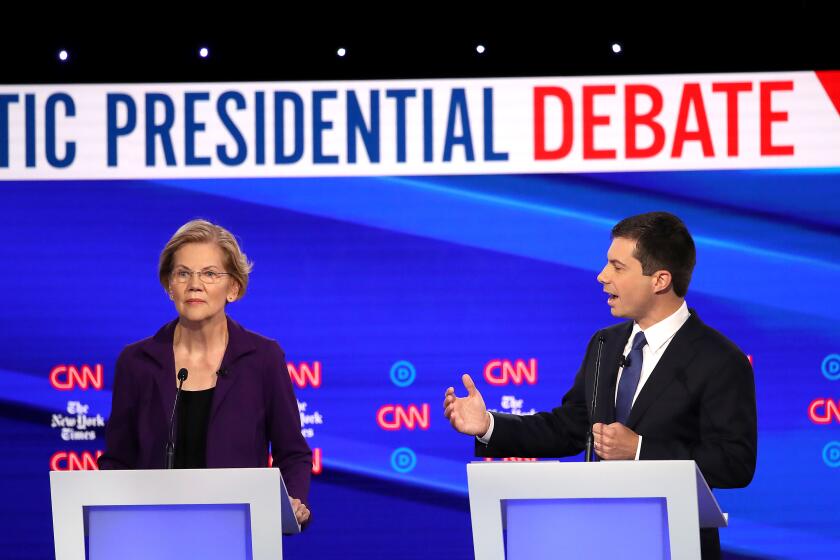 WESTERVILLE, OHIO - OCTOBER 15: Sen. Elizabeth Warren (D-MA) listens to South Bend, Indiana Mayor Pete Buttigieg during the Democratic Presidential Debate at Otterbein University on October 15, 2019 in Westerville, Ohio. A record 12 presidential hopefuls are participating in the debate hosted by CNN and The New York Times. (Photo by Win McNamee/Getty Images)