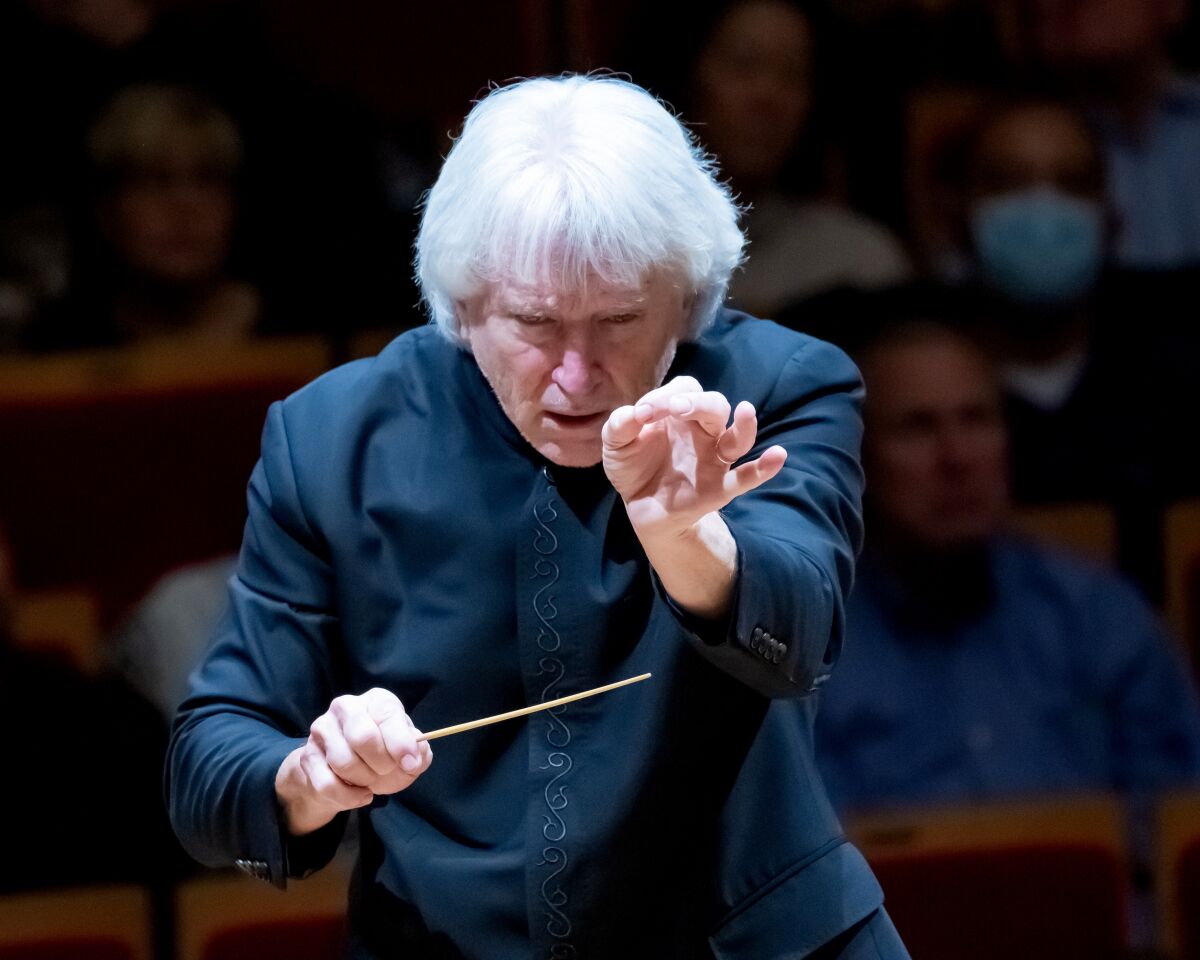 Review: Mahler's Ninth Symphony reaches revelatory new depths A man with white hair and a black button-down shirt conducts with a baton.