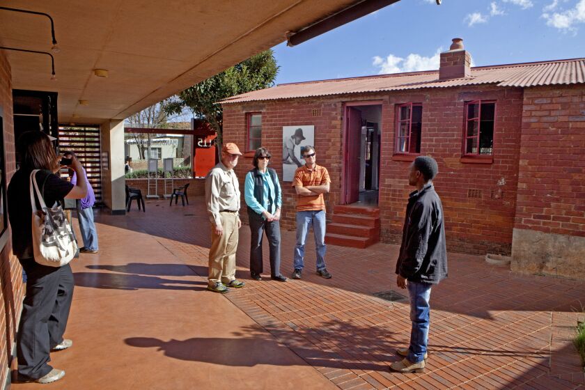 Tourists from the U.S. visit the Nelson Mandela house on Vilakazi Street that is now a museum in Soweto, South Africa. It is one of the biggest tourist attractions in the area. The Mandelas lived here in the 1960s before Nelson was imprisoned.