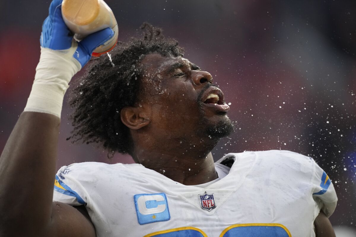 Chargers defensive tackle Sebastian Joseph-Day douses his head with water.