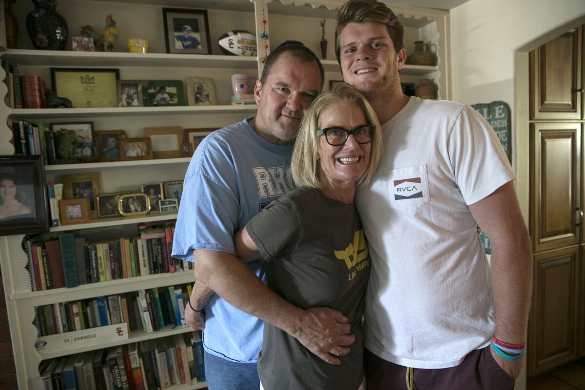 Sam Darnold with his mother, Chris, and father, Mike Darnold at their home in San Clemente. (Robert Gauthier / Los Angeles Times)