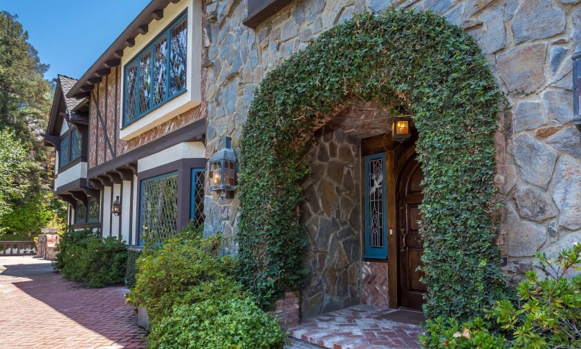 Stone, brick and half-timbering accent the exterior of the English Tudor house in Encino.